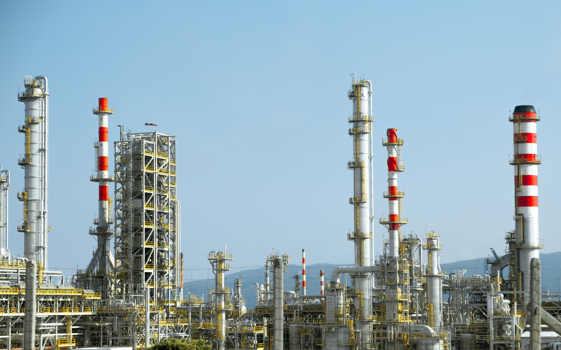 Refinery with dense red and white piping
