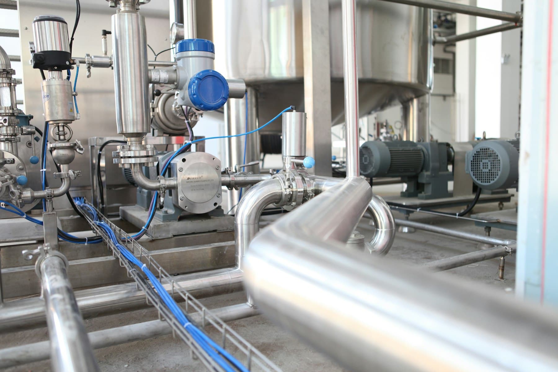 Grey industrial mechanical equipment inside a plant
