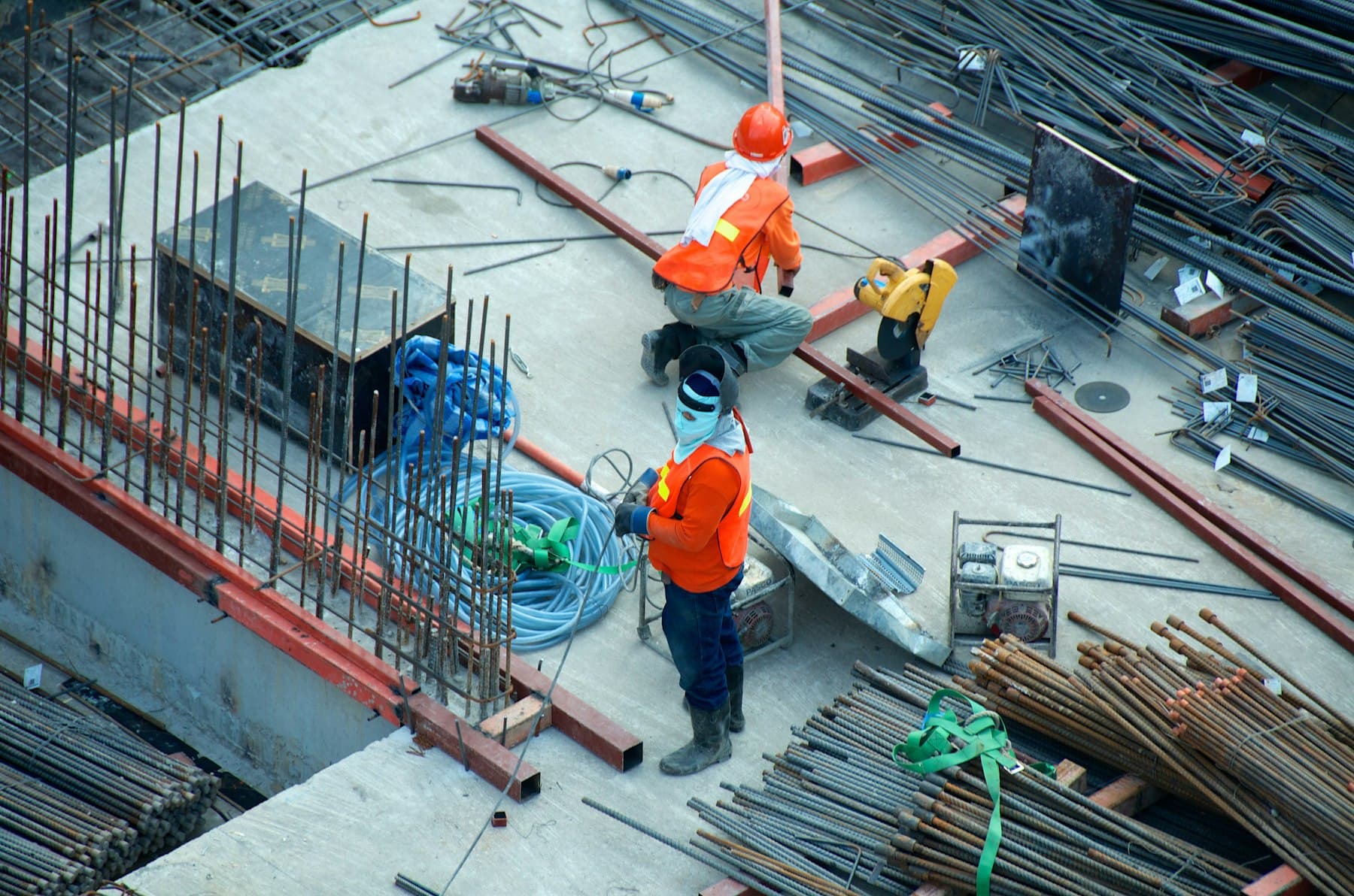 Two workers on an industrial project site